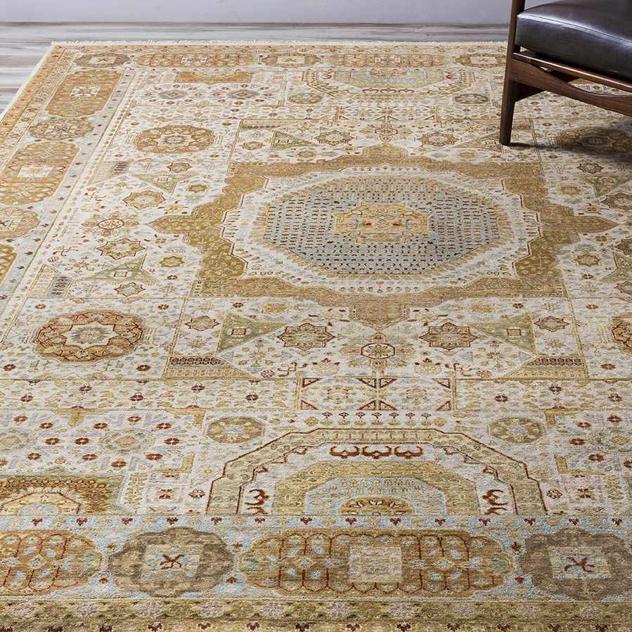 Detailed view of the Owenton Area Rug, a traditional hand-knotted rug with brick red, brown, and beige tones. Styleshot
