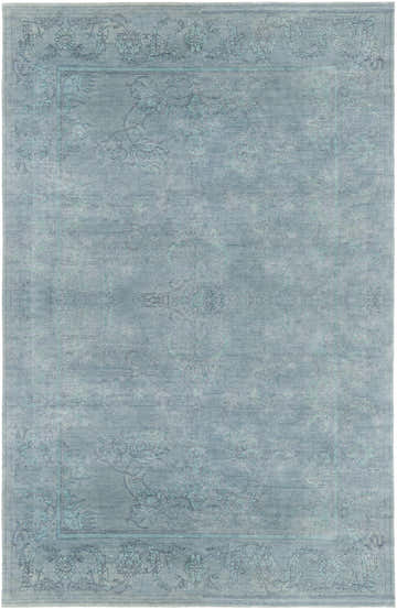 Close-up of the hand-knotted Oxly Area Rug. Features a traditional floral pattern in blue, lavender, and sage tones. Design-Rectangle-69