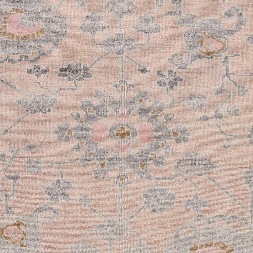 Close-up of the Pittston Area Rug showing beige, charcoal, and dusty pink floral traditional hand-knotted design. Swatch