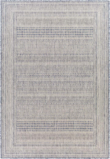 Close-up of the Panaytayon Area Rug. Cream and navy rug with a contemporary, geometric pattern and woven texture. Design-Rectangle-537