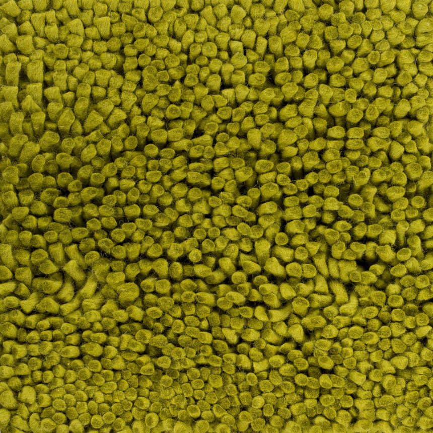 Close-up of the Frederika Solid Olive Green Wool Shag Rug showing its texture and hand woven construction. Swatch
