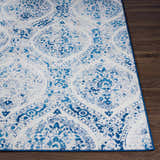 Close-up of the Penrhyndeudraeth Area Rug. Blue and off white traditional pattern on a machine woven rug. Front