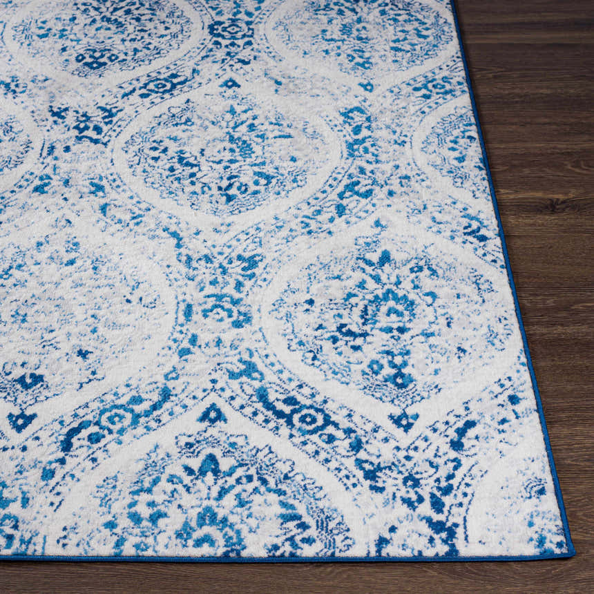 Close-up of the Penrhyndeudraeth Area Rug. Blue and off white traditional pattern on a machine woven rug. Front