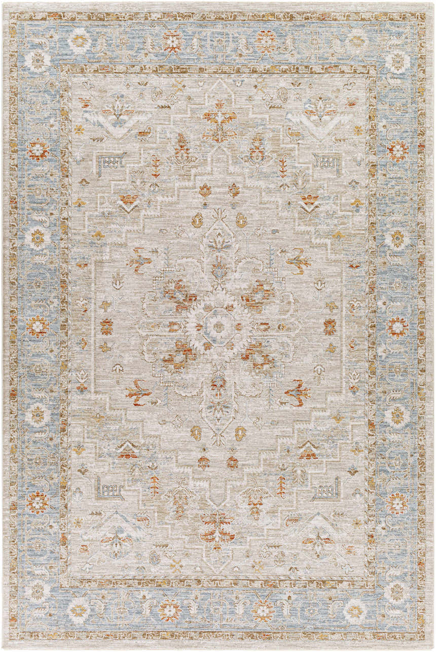 Close-up of the Phyllis Thick Luxe Statement Rug. Features traditional patterns in light beige, denim blue, and brick red. Design-Rectangle-6796