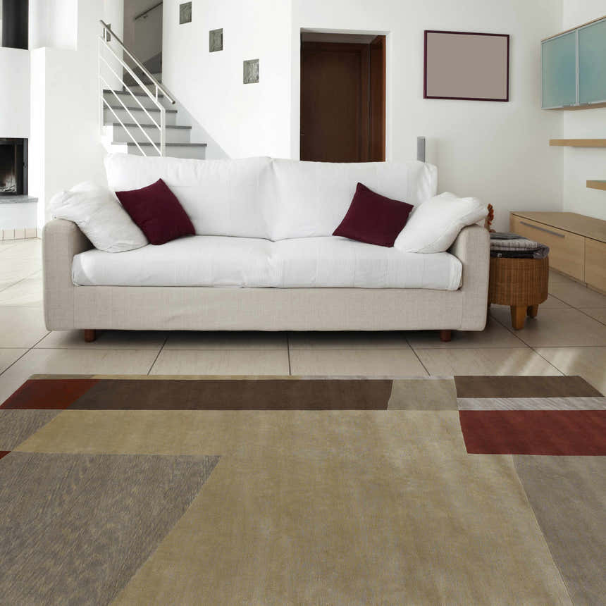 Living room scene with a contemporary Piedra Premium Wool Area Carpet in beachhouse, tan, and walnut colors. Roomscene-Rectangle
