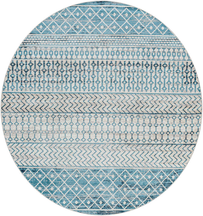 Close-up of a round Pinamopoan Washable Area Rug. Features a contemporary geometric pattern in light blue, ink blue, and light gray. Design-Round-67