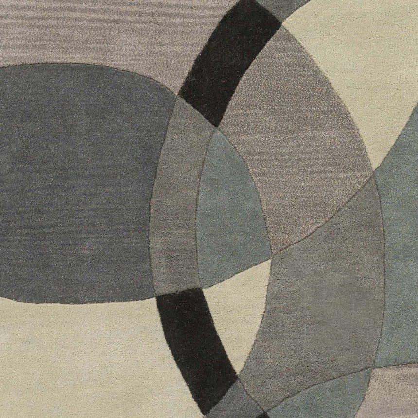 Close-up of the Rilton Gray Wool Carpet featuring a modern geometric design in shades of black, charcoal, gray, and taupe. Swatch