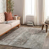 Living room scene with a beige sofa and the Palanit Thick Luxe Boutique Rug in gray, beige, and teal tones. Contemporary style. Roomscene-Rectangle