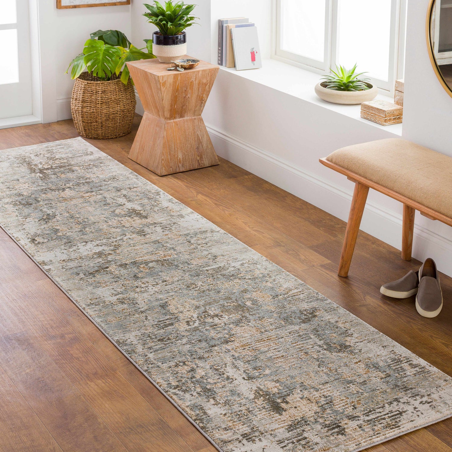 Entryway with Palanit Thick Luxe Boutique Rug runner in gray, beige, and teal. Wood floors, bench, and plants create a welcoming space. Roomscene-Runner