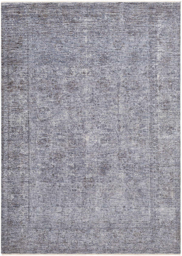 Close-up of the Plympton Carved Statement Rug, showing a textured pattern in shades of blue, gray, and ivory. Design-Rectangle
