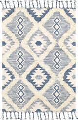 Close-up of Painesdale Blue/White wool rug. Bohemian style with diamond pattern and ivory shag accents and tassels. Design-Rectangle-576