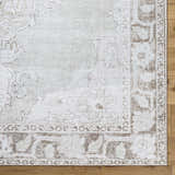 Close-up of Livabliss x Our PNW Home Rainier Medallion Gray Washable Rug showing farmhouse style and medallion pattern. Corner