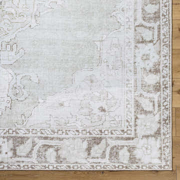Close-up of Livabliss x Our PNW Home Rainier Medallion Gray Washable Rug showing farmhouse style and medallion pattern. Corner
