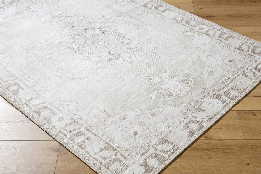 Close-up of Livabliss x Our PNW Home Rainier Medallion Gray Washable Rug showing farmhouse style and medallion pattern. Corner