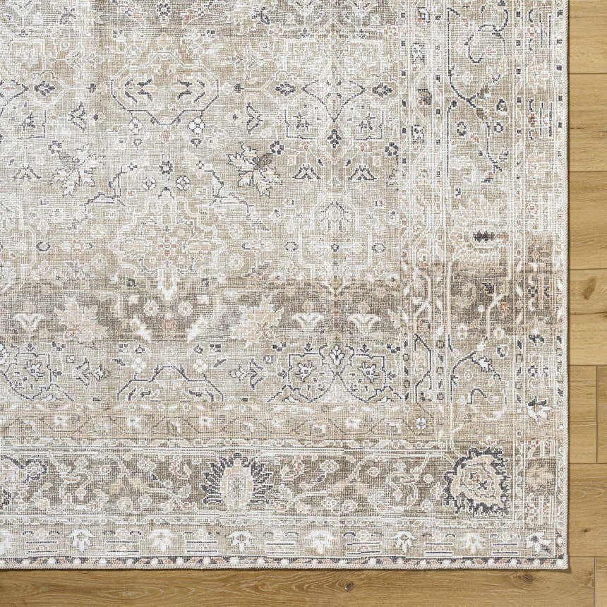 Close-up of the PNW Home Rainier Damask Light Brown Washable Rug showing its traditional pattern and light brown, tan colors. Corner