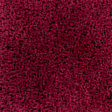 Close up of the dark red, hand woven Porter Area Rug shag texture. Swatch