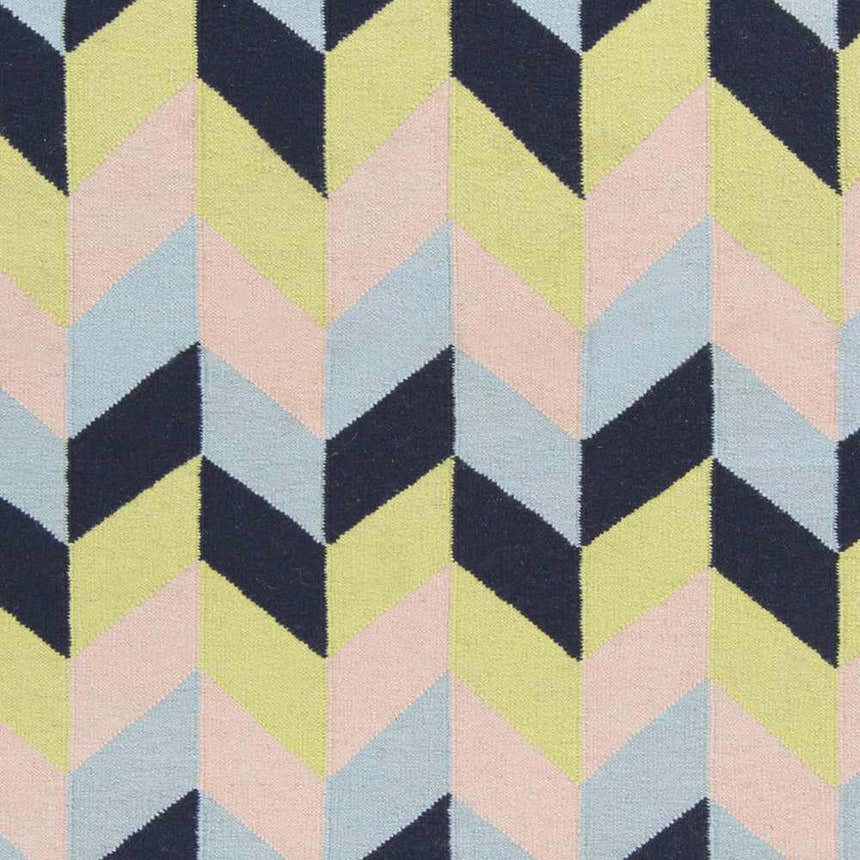 Close-up of Pojoaque Area Carpet. Hand woven wool rug with a contemporary chevron pattern in navy, olive, pink, and pale blue. Swatch