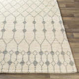 Close-up of the hand woven Pooleville Area Rug. Ivory wool rug with a medium gray diamond trellis pattern. Farmhouse style. Front