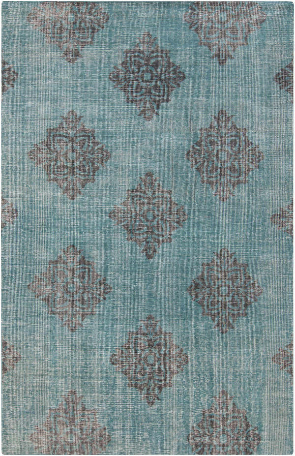 Close-up of the hand-knotted Presidio Area Carpet. Emerald background with black diamond medallion pattern. 100% wool texture. Design-Rectangle