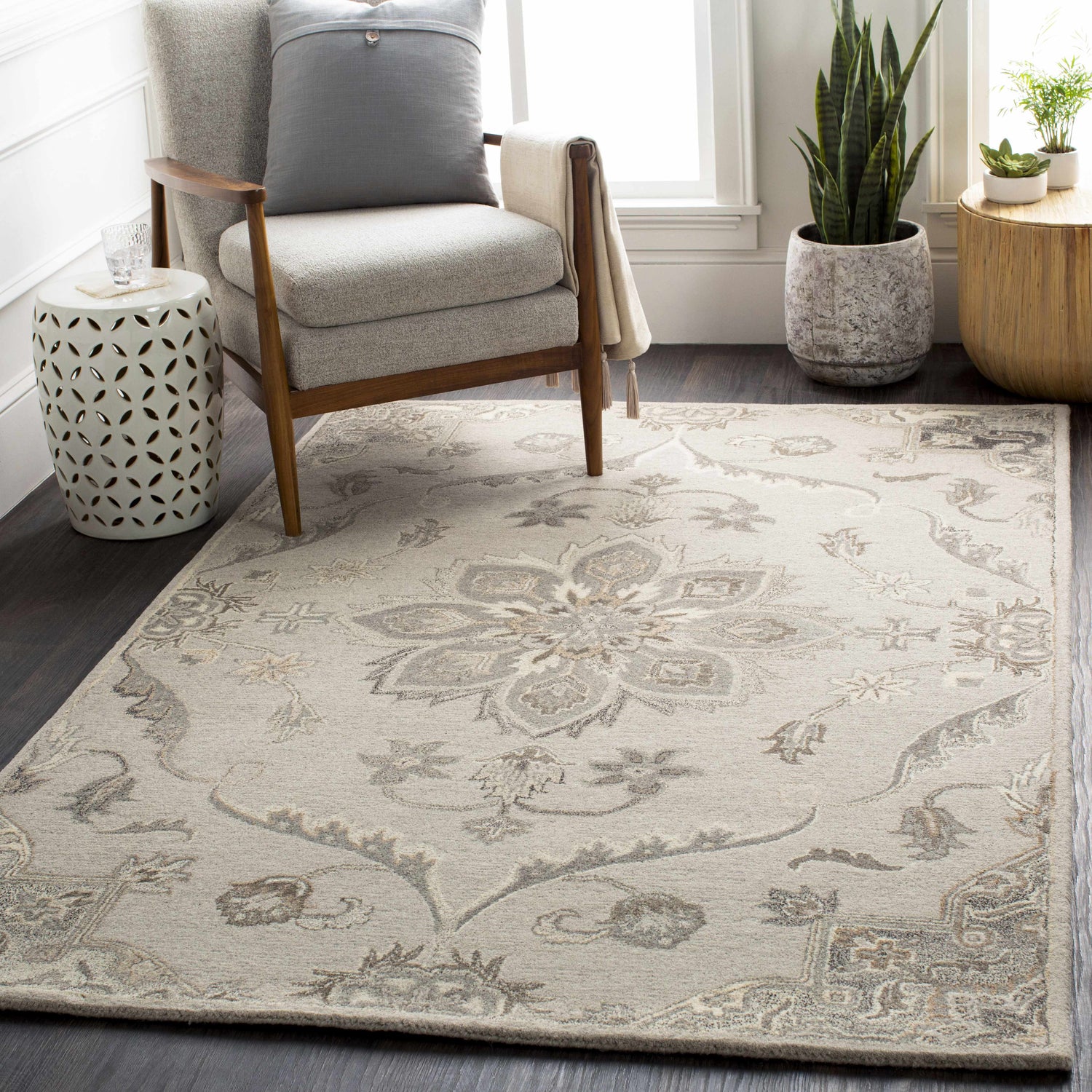 Living room scene with a beige armchair on a Peterstown Beige Wool Rug with a floral pattern. Roomscene-Rectangle