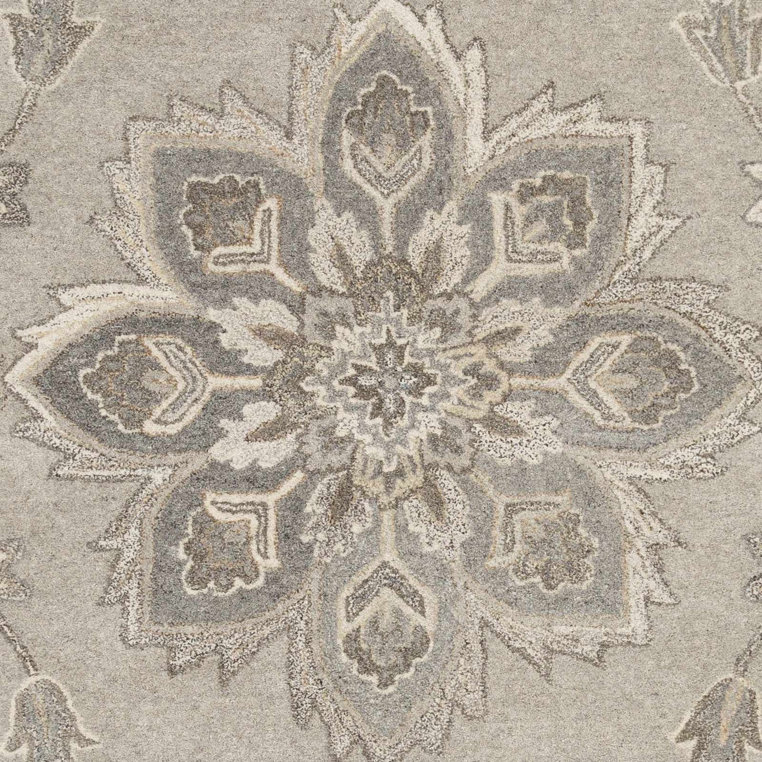 Close-up of the Peterstown Beige Wool Rug featuring a detailed floral medallion pattern in beige, tan, and charcoal hues. Swatch