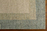 Close up of the hand-tufted Pualas Area Rug showing cream, sage, and light beige stripes and wool texture. Corner