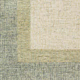 Close-up of a hand-tufted Pualas Area Rug. Cream, dusty sage, light beige, and light olive wool rug with a striped pattern. Swatch