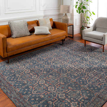 Living room with a tan leather couch and blue Urbancrest Premium Rug. Roomscene-Rectangle