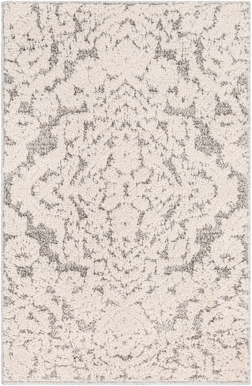 Close-up of the Rockeagle Area Rug: a machine-woven, rectangular rug in beige and charcoal with a traditional, oriental-inspired pattern. Design-Rectangle-23