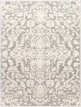 Close-up of the Rockeagle Area Rug. Beige and gray with a traditional, floral-inspired pattern. Machine woven texture. Design-Rectangle-71713