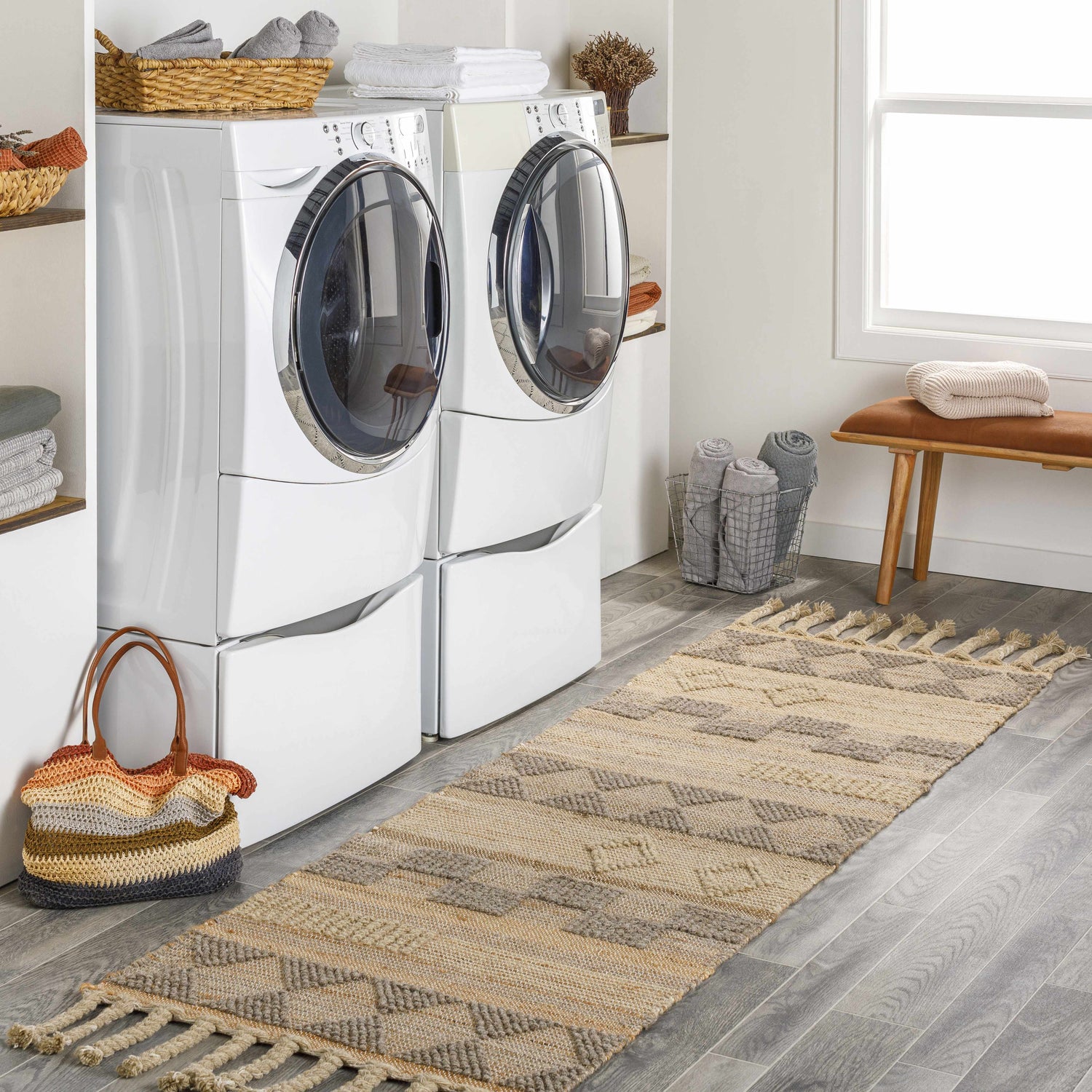 Laundry room with gray wood-look floors and Ardee Totem Jute & Wool Blend Rug runner with tassels. Roomscene-Runner