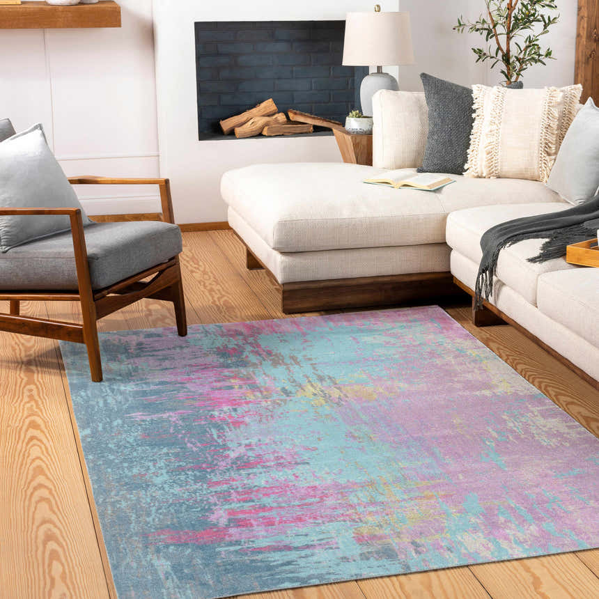 Living room scene with a Redland Colorful Abstract Rug, cream sofa, gray chair, and wooden floors. Roomscene-Rectangle