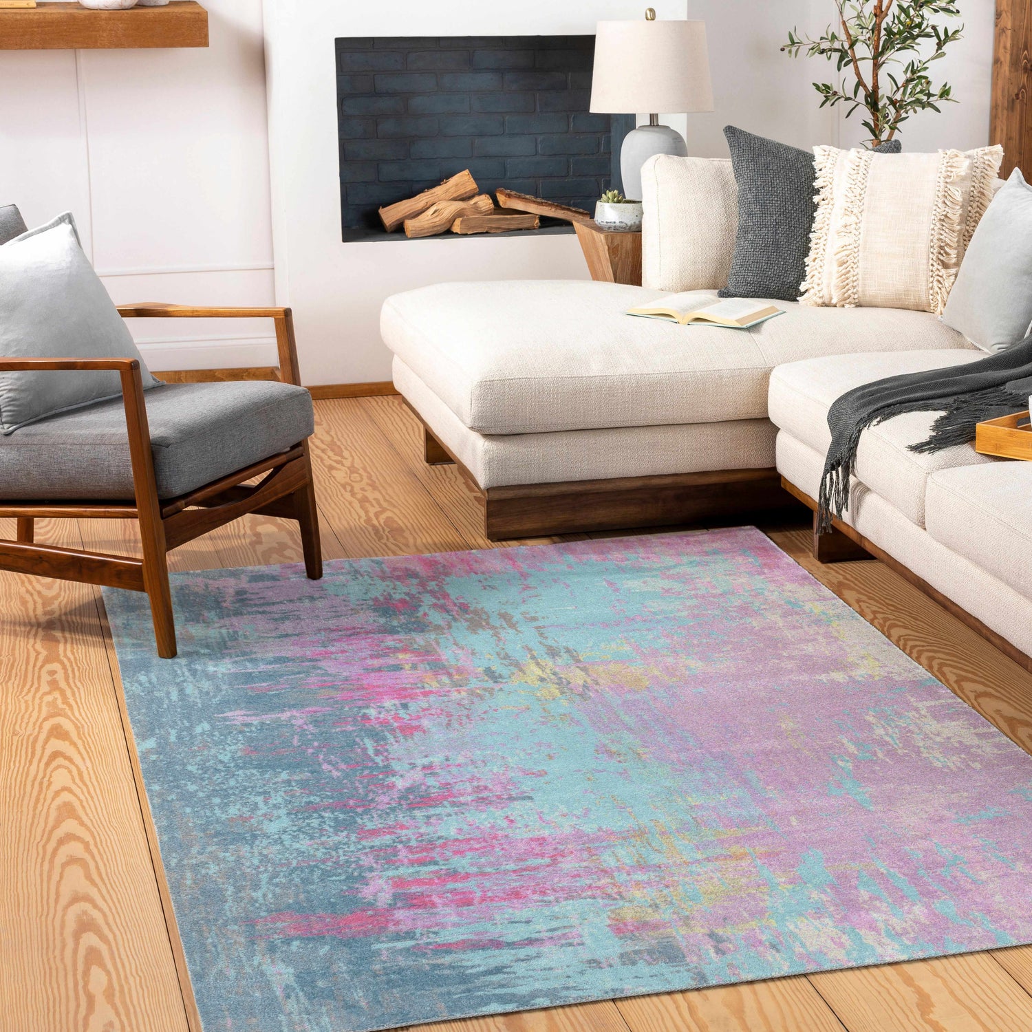 Living room scene with a Redland Colorful Abstract Rug, cream sofa, gray chair, and wooden floors. Roomscene-Rectangle