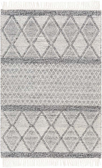 Close-up of the Rehn Area Rug featuring a geometric diamond pattern in dark gray, light gray, and taupe with fringe. Design-Rectangle-576