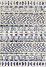 Close up of the Renick Area Rug. Bohemian style rug with blue geometric patterns on a cream background. Design-Rectangle-5376