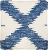 Close-up of the Oradell Blue Ikat Wool Rug. Hand-woven rug in cream and navy with a geometric ikat pattern. Swatch