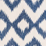 Close-up of Oradell Blue Ikat Wool Rug showing cream background and navy blue geometric diamond pattern. Swatch