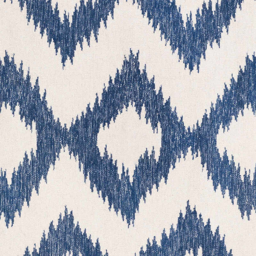Close-up of Oradell Blue Ikat Wool Rug showing cream background and navy blue geometric diamond pattern. Swatch