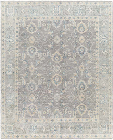 Close-up of the hand-knotted Armin Area Rug. Gray wool rug with traditional floral pattern in ivory, taupe, and seafoam. Design-Rectangle-810