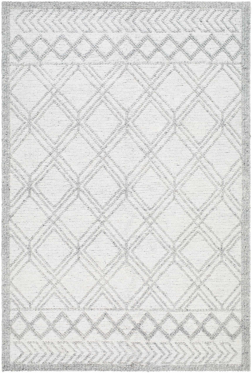 Close-up of the Rena Area Rug. Hand-woven farmhouse style rug in arctic stone, dark gray, and gray with a geometric diamond pattern. Design-Rectangle-576