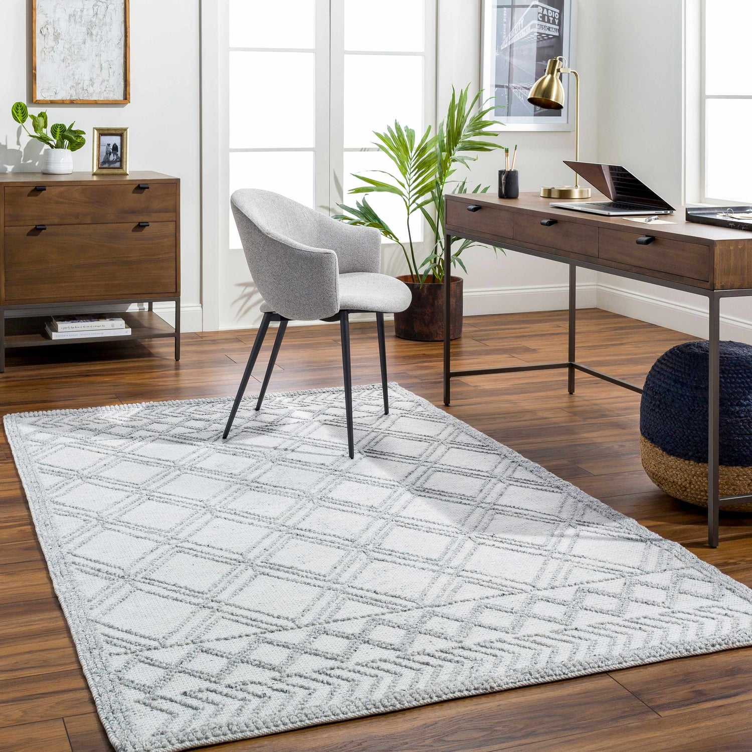Home office with a gray Rena Area Rug, wood desk, gray chair, and wood dresser. Roomscene-Rectangle