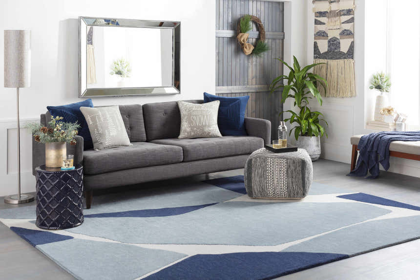 Living room scene with gray sofa and blue Robbins Modern Blue Wool Rug featuring geometric pattern. Roomscene-Rectangle