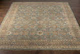 Close-up of the Rockton Area Rug, a hand-knotted wool rug with a traditional pattern in black, brown, sage, and light beige. Front