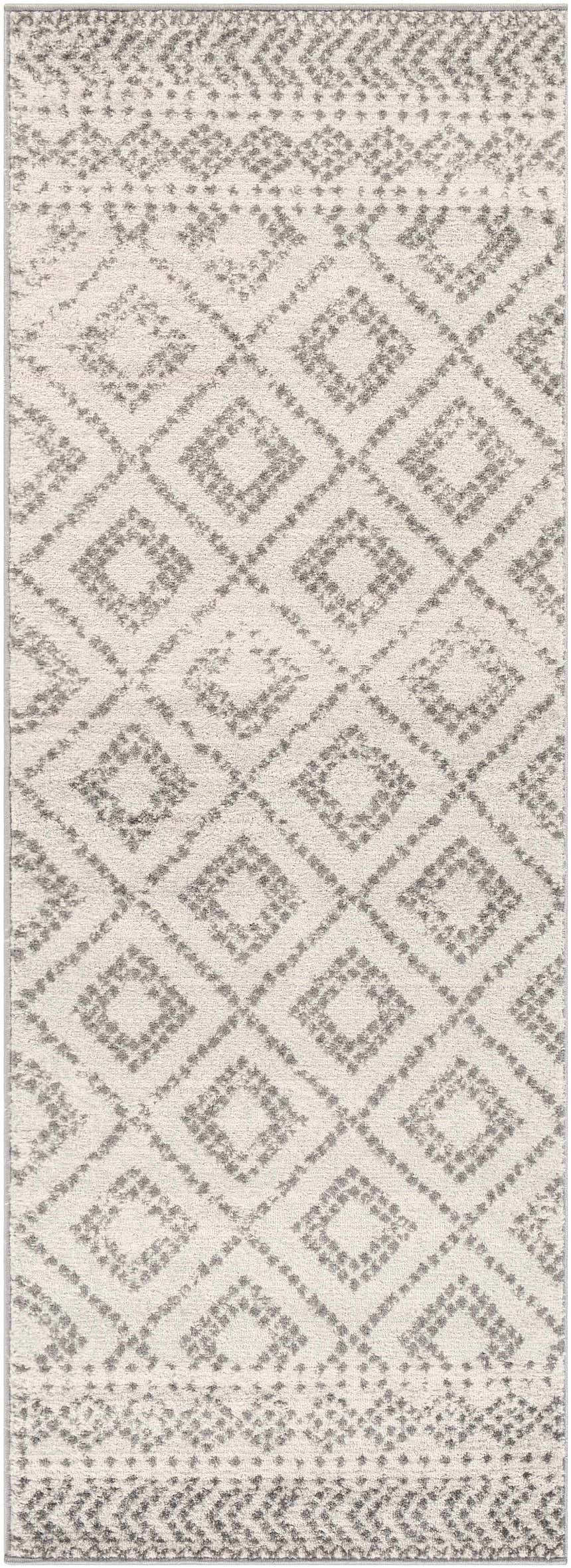 Close-up of the Romeoville Area Rug. White rug with gray diamond and geometric patterns. Bohemian style. Design-Runner-2773