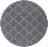 Round gray Ropesville Wool Area Rug with a light gray quatrefoil pattern. Hand-loomed wool rug. Design-Round-79