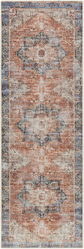 Close-up of the Rosman Distressed Washable Area Rug. Traditional design in beige, brick red, blue, and black hues. Design-Runner-2710