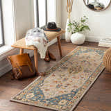 Entryway scene with a Rozel Area Rug runner in beige, blue, and orange. Bench, backpack, and decor create a welcoming vibe. Roomscene-Runner