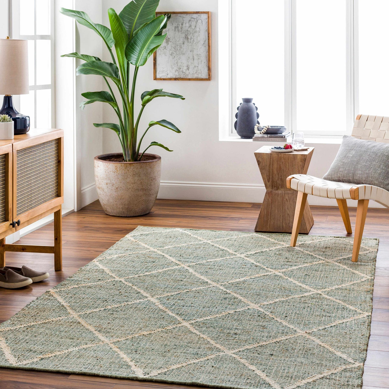 Living room scene with Ravenna Jute Rug. Bohemian style with geometric pattern in a bright, airy space. Roomscene-Rectangle
