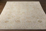Close-up of the hand-knotted Ravenshead Area Rug. Features a traditional oriental pattern in dusty sage and light beige. Front