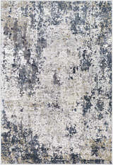 Close-up of the Ryhill Textured Luxe Area Rug, showcasing its charcoal, blue, beige, and gray contemporary design. Design-Rectangle-573